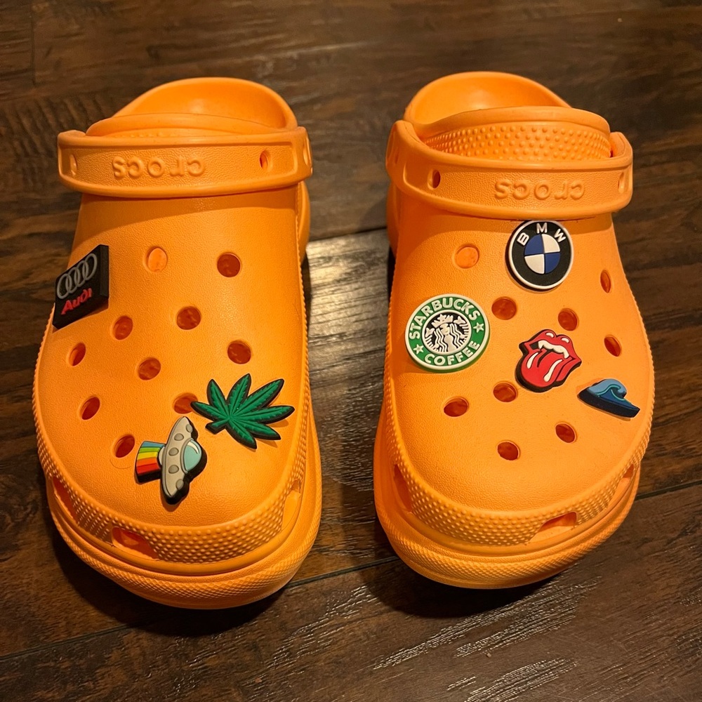 Platform crocs with jibits included.